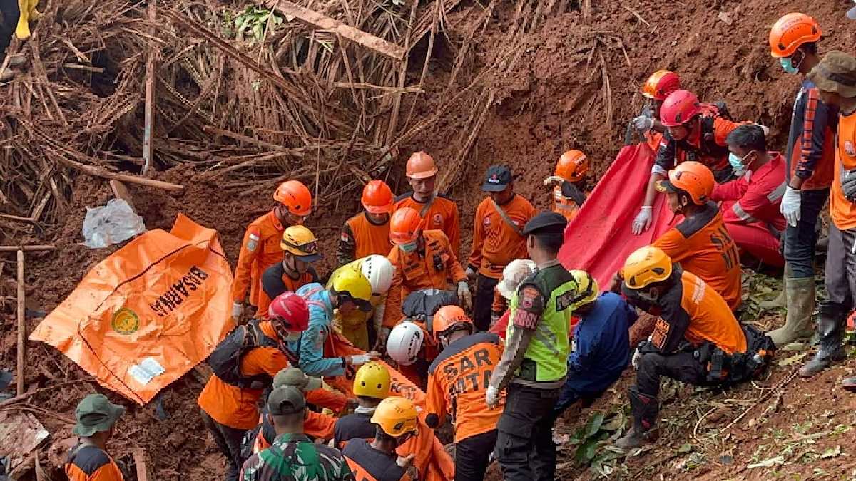 At least 18 people killed in Indonesian landslides as rescue efforts continue to find more than 30 others missing